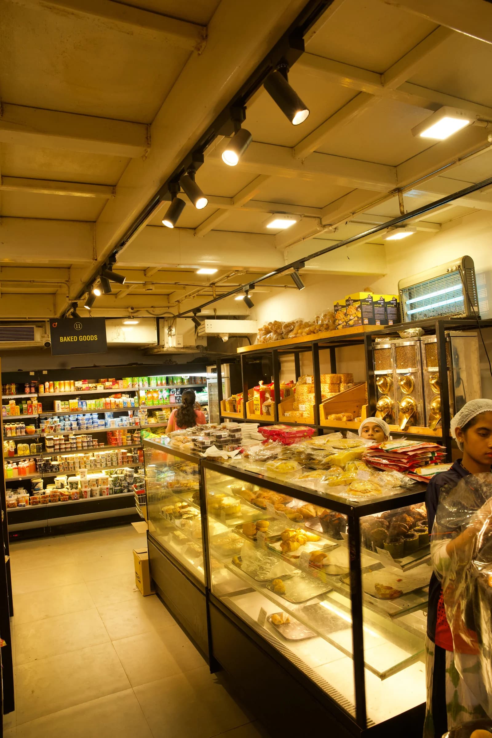 The bakery counter with glass displays and stocked shelves