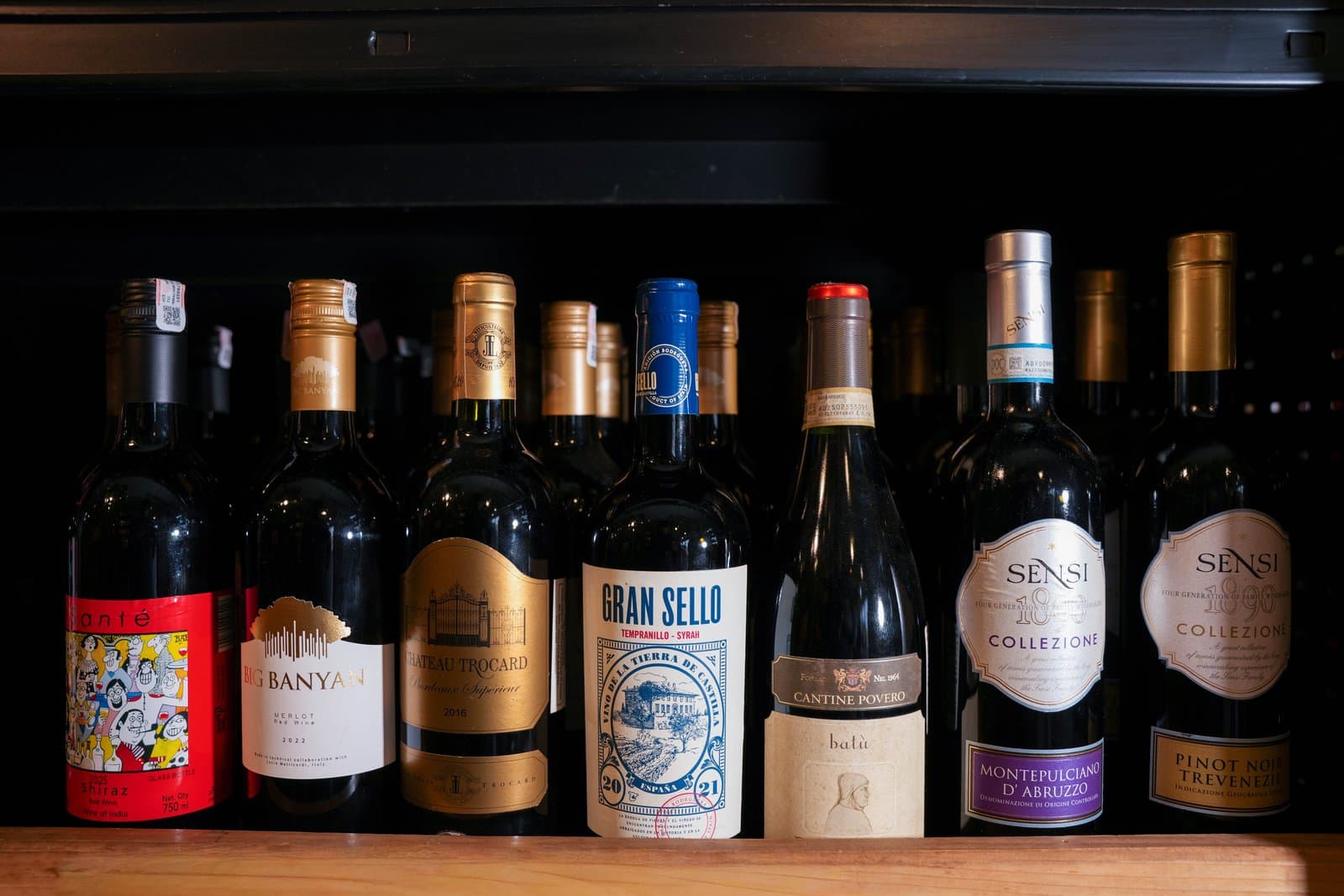 Bottles of wine lined up in the liquor section